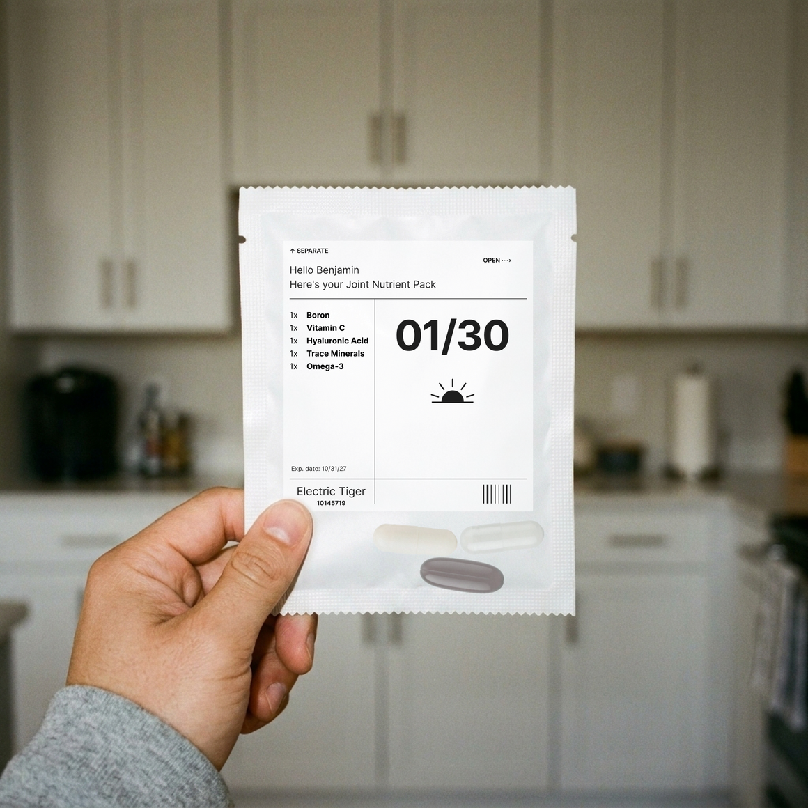 Joint Nutrient Pack: one day's pouch, held up in a kitchen