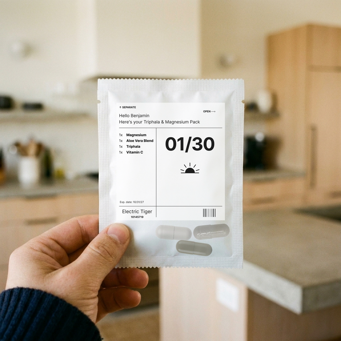 Triphala & Magnesium Pack: one day's pouch, held up in a kitchen